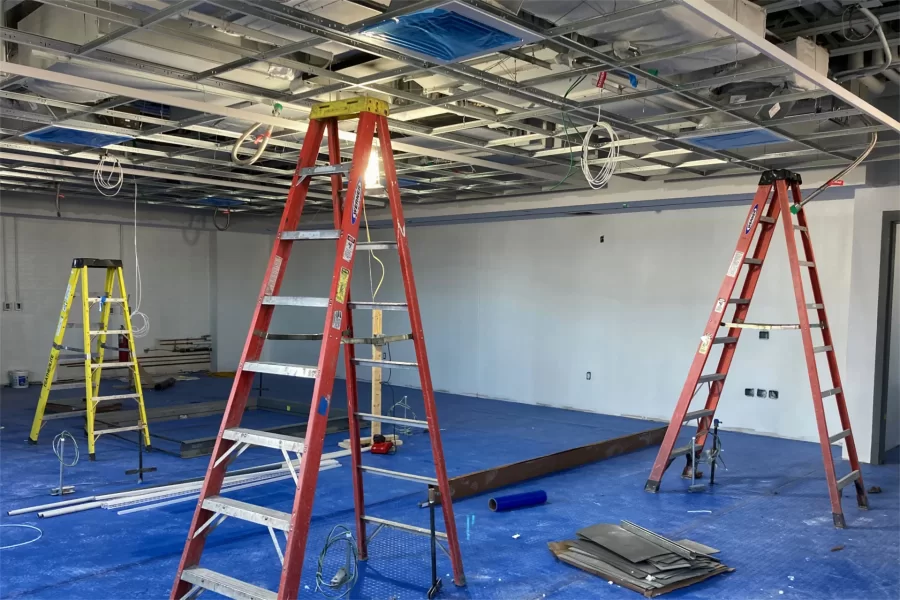 Above-ceiling MEP  installation (not punch-listing) in progress in a third-floor classroom. (Doug Hubley/Bates College)