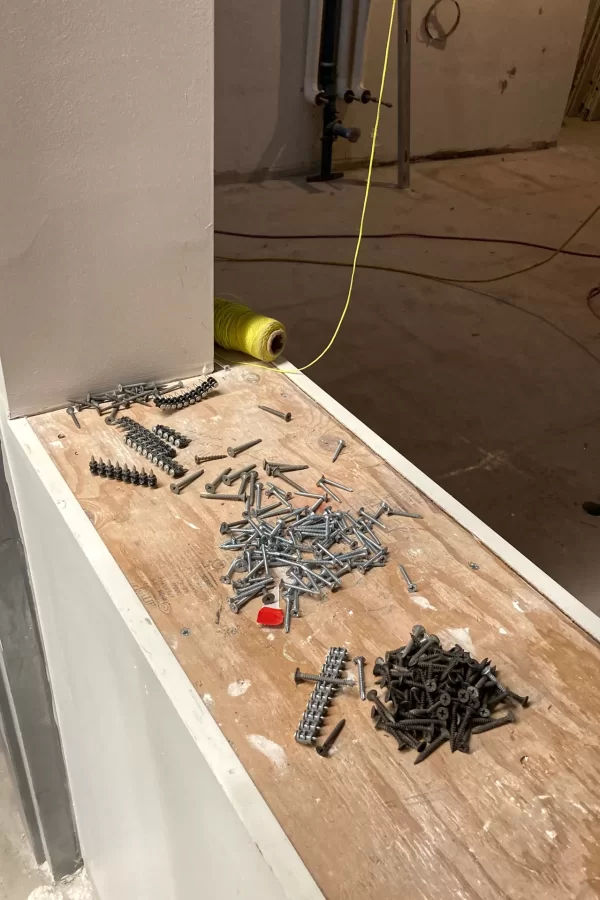 Fasteners awaiting use on a new sill at Dana's chemical storeroom. A subtle sign of progress in the Dana renovation is the appearance of such sills around new windows that till now had been just rough openings. (Doug Hubley/Bates College)