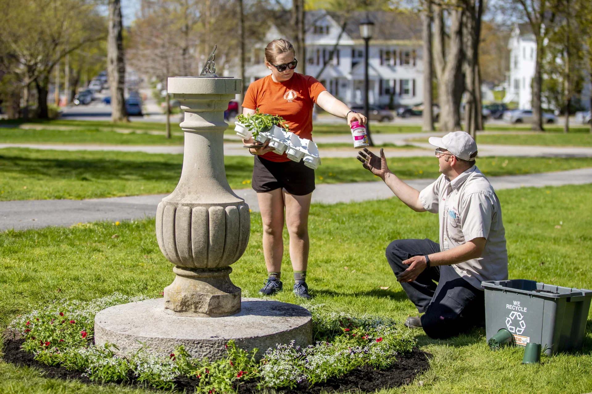 Grounds & Maintenance Lead - Horticulture Focus Jeremy Lavertu  and Charlotte Collins ’22 (of Woolwich, Maine, plant around the sundial in front of Coram Library on the Historic Quad, beautifying the area in preparation for Commencement 2022.