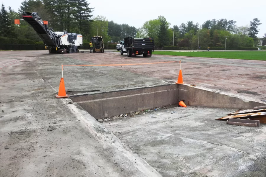 The steeplechase water jump at the Russell Street track has been made more shallow, from 70 centimeters to 50, in coliance with new NCAA rules for the event. The work was part of a track refurbishment that also brought the crew and machinery to the site to remove a layer of asphalt underlayment from the track as a prelude to resurfacing the track. (Jay Burns/Bates College)