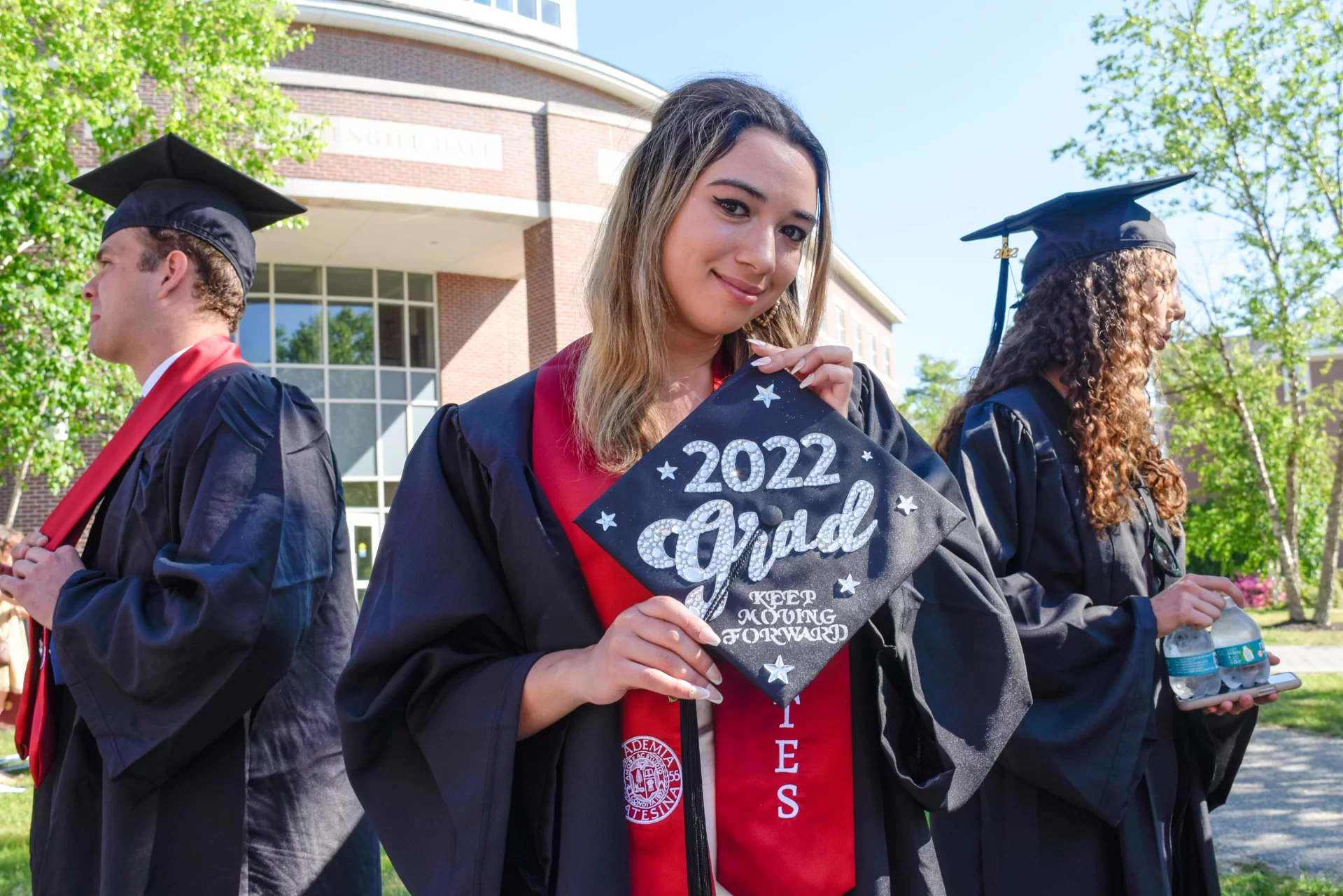 Graduates of the Class of 2022 walked in style at Bates College's 156th Commencement on May 29, 2022, with decorated caps, stoles, and other accessories.Zane Rahabi ’22, (Lord of the Rings meme) Geology major, mathematics minor, Westwood, Mass.Rebekah Vaules, ("Up" schoolhouse) French and Francophone studies major, Education, religious studies minors, Pittsford, N.Y.Olivia Dimond, ("the sexy scholar gig") Theater major, education minor, Henrico, Vir.Daniah Foster, (pink and gold glitter and flowers) American studies major, anthropology minor, Shelton, Conn.Rachel Retana, (Mexican loteria board) Politics, gender and sexuality studies majors, African American studies minor, Chicago, Ill.Adama Diaby, ("pretty, educated & graduated") politics major, history minor, New YorkJanell Sato, (haku lei with red roses and raffia) biology major, religious studies minor, Honolulu, Hawai’iIsabella David, ("keep moving forward") politics major, rhetoric, film, and screen studies minor, East Elmhurst, N.Y.Jenniflore Beaubrun, (flowers on side and red ribbons) mathematics major, African American studies and digital and computational studies minors, Hyde Park, Mass.Alex Teplitz, (googly eyes) English major, gender and sexuality studies minor, he/they, New YorkOjochenemi Maji, (daisies and butterflies on cap, nails, and stole) geology major, digital and computational studies minor, Nigeria