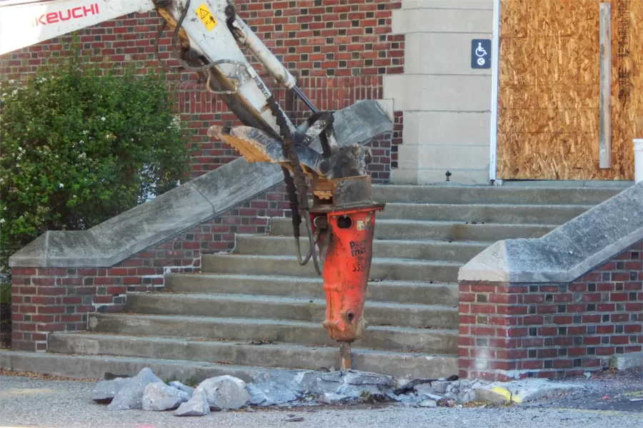 The beginning of the end for the steps at Chase Hall's main entrance, seen on June 6, 2022. The building entrance will be lowered to ground level. (Doug Hubley/Bates College)