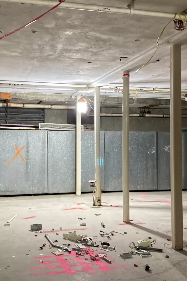 A new grand stairway will  terminate in this approximate location in the basement of Chase Hall. The College Store formerly had office and stockroom space here. (Doug Hubley/Bates College)