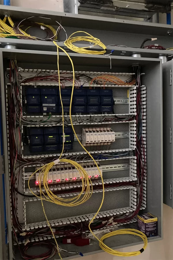 This panel in Dana Hall’s attic contains controls for local HVAC units serving each room in the building. (Doug Hubley/Bates College)