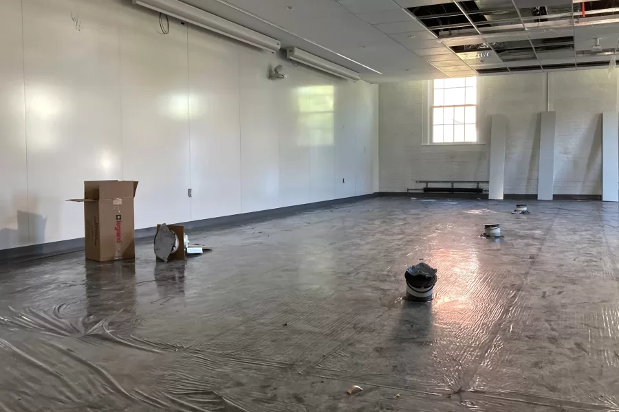 A third-floor bio lab in Dana Hall. The boxes projecting from the floor show where lab benches will be set: The boxes carry utility connections to the benches. The shiny wall surfaces can be written on. (Doug Hubley/Bates College)