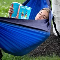 Spotted at Bates: Annie Conway '23 of South Salem, N.Y., enjoying a novel on Alumni Walk, and Ben Fasciano '23 of Lincoln, Mass., and Andrew Hoffman ‘23 of Oak Park, Ill., playing disc golf on Lake Andrews.They're each living in Lewiston during the summer for jobs and internships. And making the most of a beautiful, quiet campus.