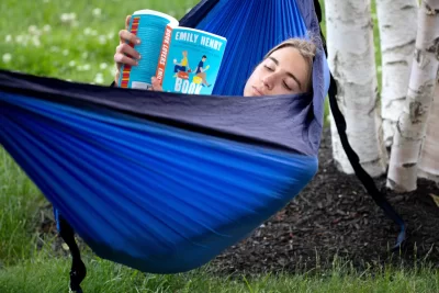 Spotted at Bates: Annie Conway '23 of South Salem, N.Y., enjoying a novel on Alumni Walk, and Ben Fasciano '23 of Lincoln, Mass., and Andrew Hoffman ‘23 of Oak Park, Ill., playing disc golf on Lake Andrews.They're each living in Lewiston during the summer for jobs and internships. And making the most of a beautiful, quiet campus.