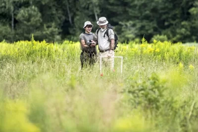 Measuring pollen and fighting ticks: it’s been their full-time job this summer.For eight weeks, Henry Hardy’22 of Gloucester, Mass., and Sebastian Leon Fallas ’24 of Perez Zeledon, Costa Rica have studied the pollen environment in a meadow at Thorncrag Nature Sanctuary under the supervision of Associate Professor of Biology Carla Essenberg.Leon Fallas is a STEM Scholar, and Hardy, a Bates Summer Research Fellow.Swipe left for a few scenes from their research this afternoon, July 22, 2021, that included applying bug spray and slipping into mesh shirts before heading out to take notes and measurements and gather samples.