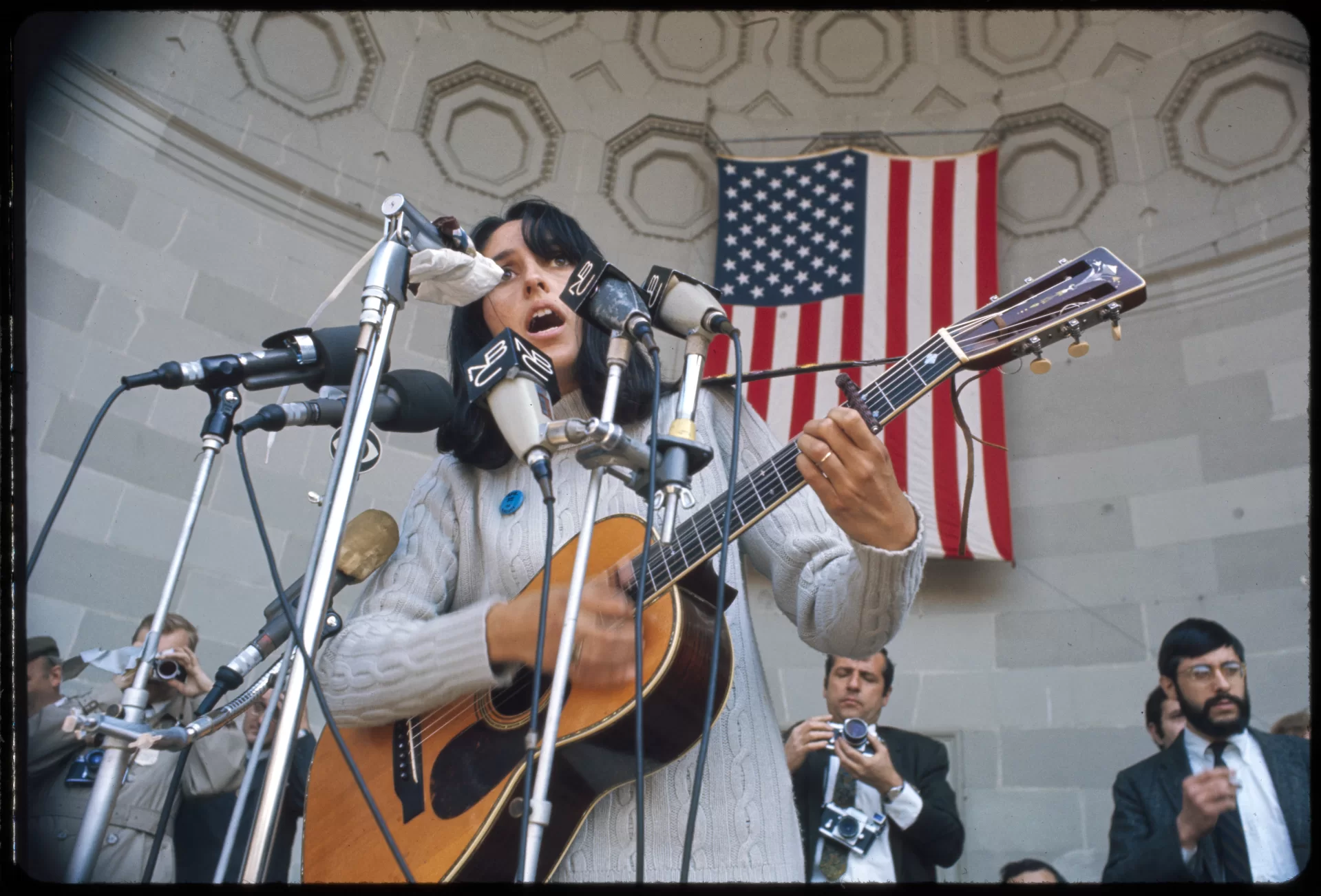 Joan Baez sings at an anti-draft demonstration, Central Park, Bandshell, in 1968. (Bernard Gotfryd/Library of Congress, Bernard Gotfryd photograph collection Library of Congress Prints and Photographs Division https://www.loc.gov/item/2020736593/), https://www.loc.gov/item/2020737196/.