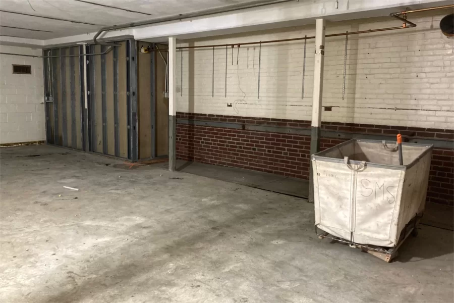 A new main stairway from the Chase Hall entrance nearest Muskie Archives will touch down at this location near the old Dining Services loading dock. (Doug Hubley/Bates College)