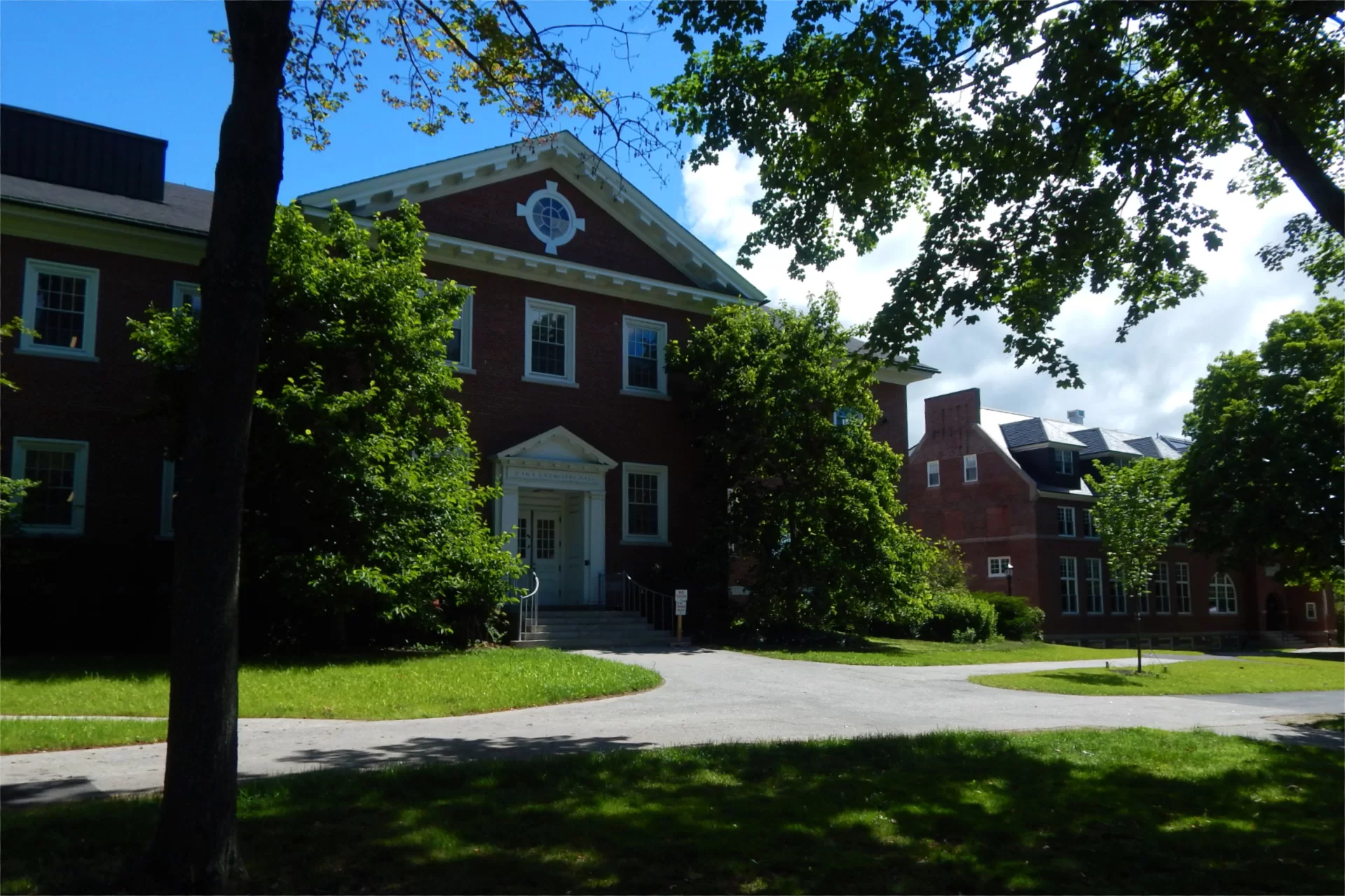 Dana Hall seen from a shady patch on the Historic Quad on July 6, 2022. (Doug Hubley/Bates College)