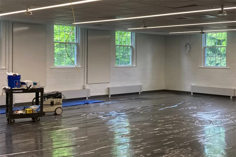 A clear plastic membrane protects new carpeting in a second-floor Dana Hall classroom. (Doug Hubley/Bates College)