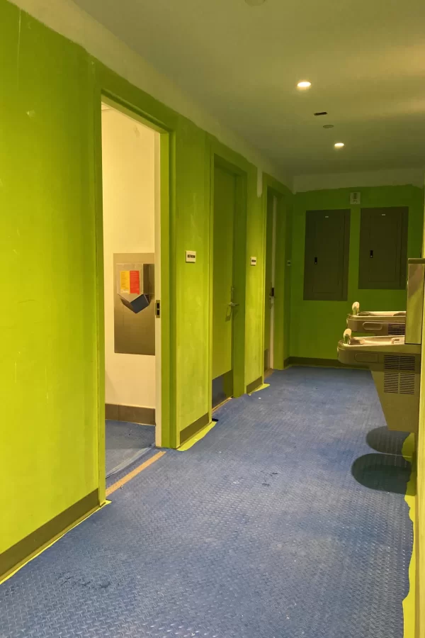 A partially painted second-floor restroom corridor. (Doug Hubley/Bates College)