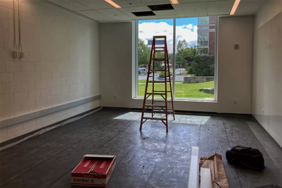 A new window will give students using this Dana Hall lounge a striking view all the way to Commons. (Doug Hubley/Bates College)