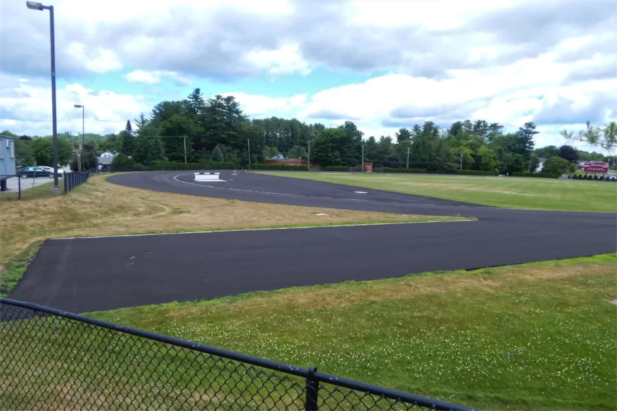 A fresh "wear coat" of asphalt on the Russell Street Track. This month the asphalt will be topped with a new Mondo track surface. (Doug Hubley/Bates College)