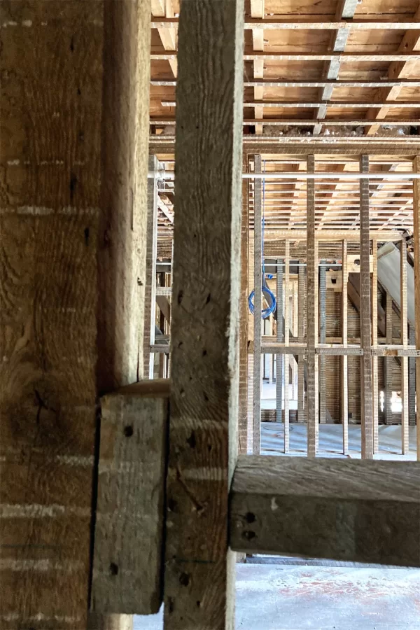 Two walls will be removed to make one room out of three on Chase Hall's second floor, but load-bearing columns like the one at left will remain and more will be added. (Doug Hubley/Bates College)