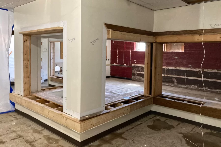 Gaping holes in these Chase Hall walls were once filled with post office boxes. Soon the walls will be gone, too. (Doug Hubley/Bates College)