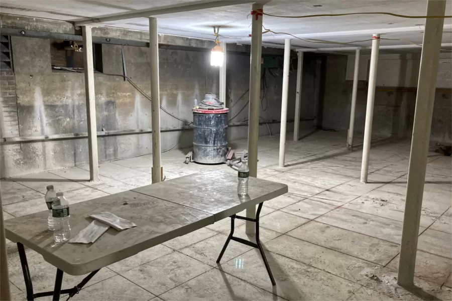 A new stairway will pass through this former College Store space. The floor has been precut to ease its demolition. (Doug Hubley/Bates College)