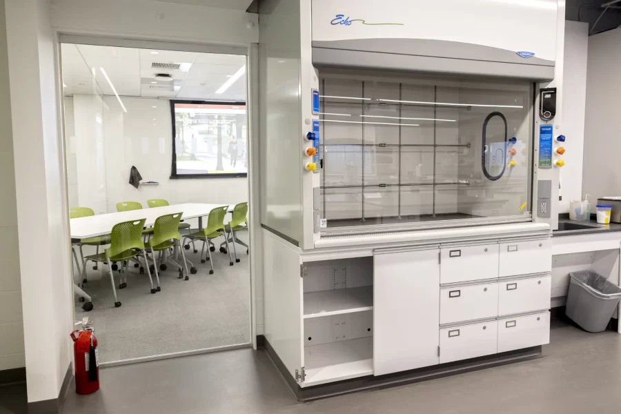 A fume hood in a first-floor chemistry lab in Dana Hall stands next to a window revealing an associated classroom. (Phyllis Graber Jensen/Bates College)