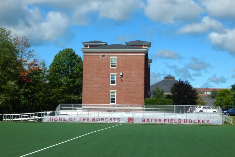 John Bertram Hall provides a backdrop to the new grandstand at the Campus Avenue Field. (Doug Hubley/Bates College)
