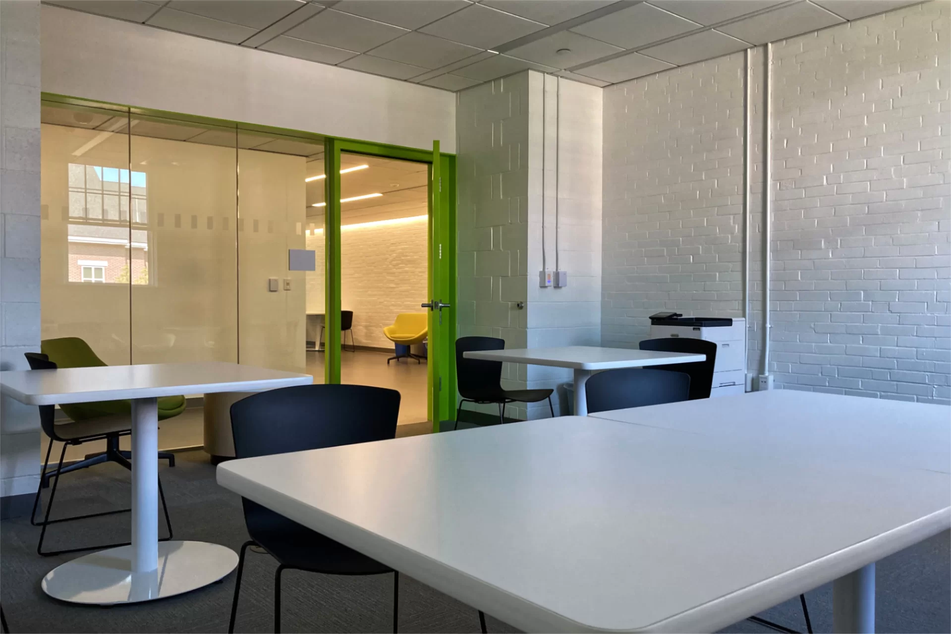 Facing Dana Hall’s second-floor lobby from a study room. A key goal of the Dana renovation was to brighten and open up the building’s dim, convoluted interior. (Doug Hubley/Bates College)