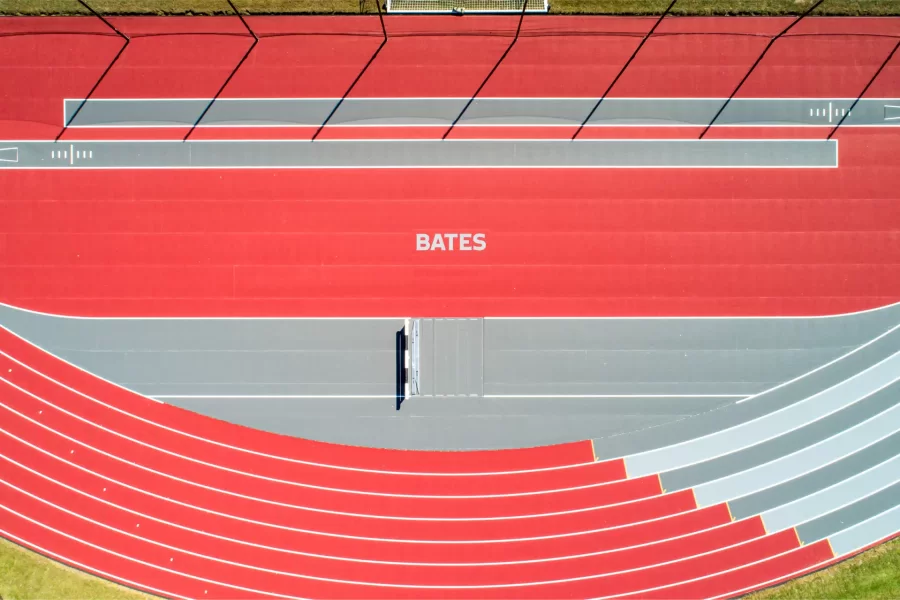 Appearing beneath the Bates wordmark in this drone image of the resurfaced Russell Street Track is the water jump for the steeplechase course. (Courtesy of Dave Cleaveland/Maine Imaging)