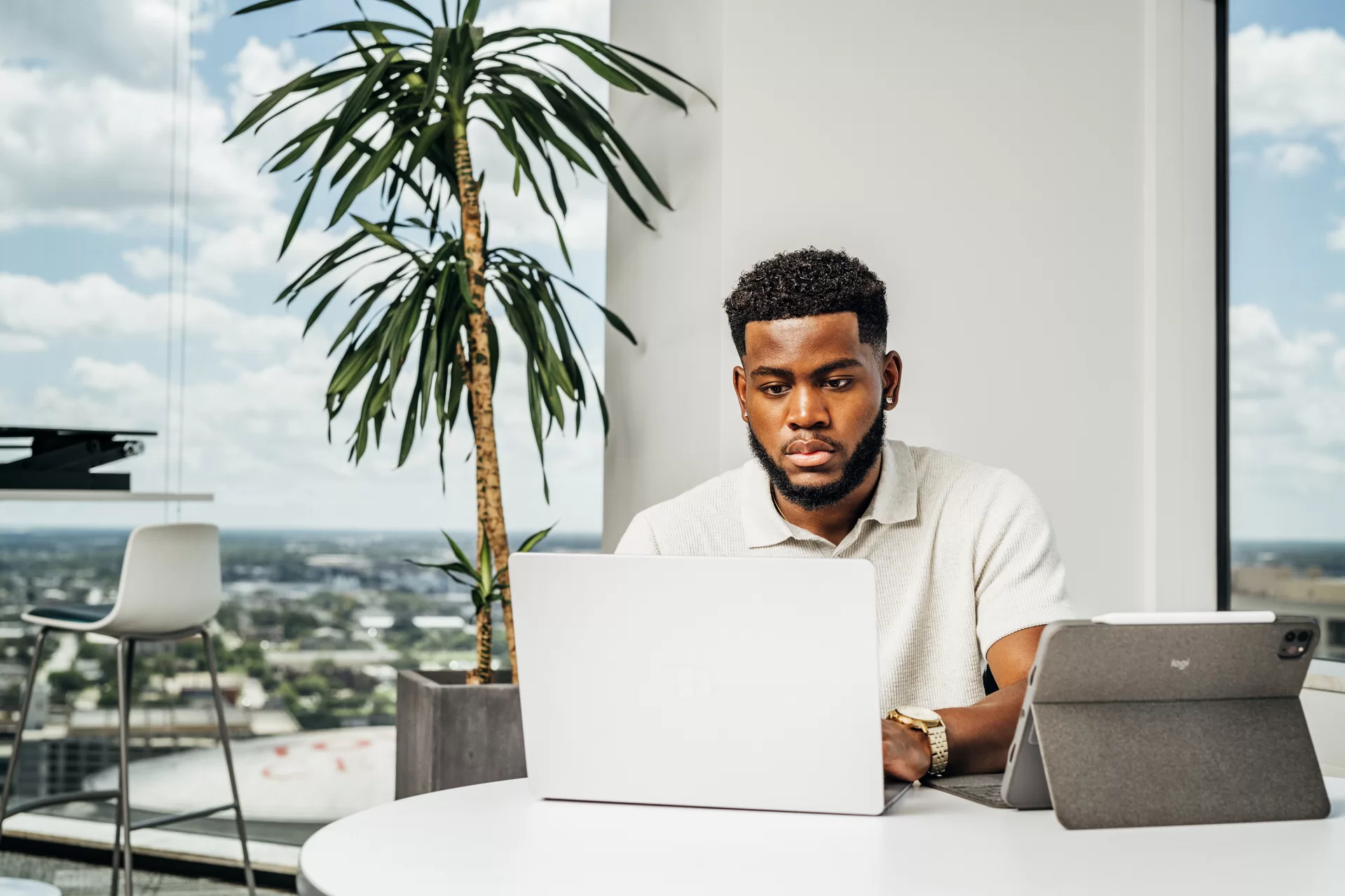 “I’ve had the opportunity to work for one of the world’s highest ranked firms.”— Kendall Williams ‘23 of Phenix City, Ala., describes his Bates-funded Purposeful Work internships with Accenture, known for its diversified service offerings to help clients form strategy, management, digital technology, and operations consulting.He is posing with the Houston skyline behind him and in Accenture’s Houston office.Williams spent the summer in the firm's Houston office, where he worked in the Technology Development Program, aligned in Security Practice. “I love the work that Accenture does,” Williams said, and after working remotely for the company’s Detroit office during the summer of 2021, he knew he wanted to return as an analyst for them.“But I also wanted to check out what it was like living and working in a new city,” he says. So he chose to move to Houston for the summer. “It has been spectacular both in my work and personal life,” he says. “I’ve been able to learn new and transferable skills and have really stepped out of my comfort zone being in a new city.”