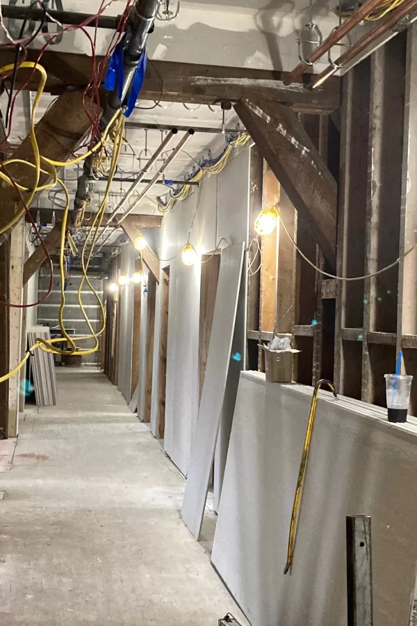 New wallboard lines the corridor on Chase Hall’s second floor. (Doug Hubley/Bates College)