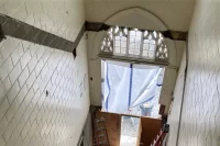 This space once housed stairs connecting the three levels of the original 1919 Chase Hall. Still a main entrance to the building but with the vertical access moved elsewhere, it will be repurposed as an atrium. (Doug Hubley/Bates College)