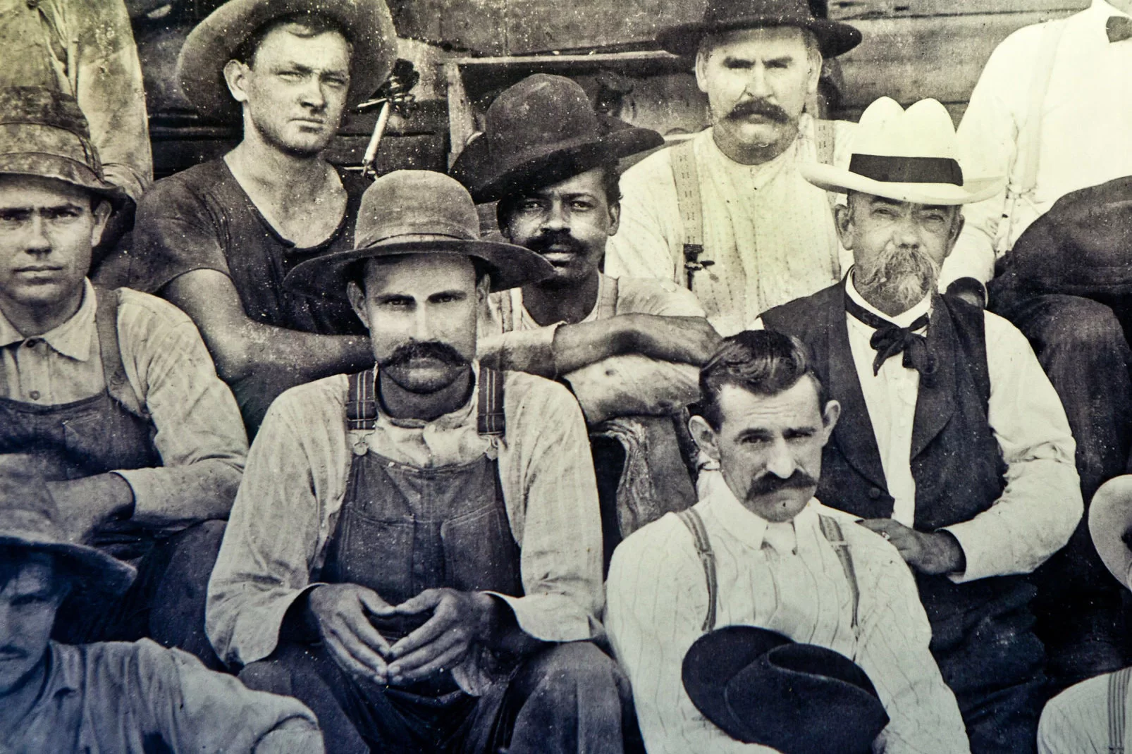 Historic image of Jack Daniel seated next to George Green, the son of Nathan "Nearest" Green, the man who taught Jack Daniel how to make whiskey.