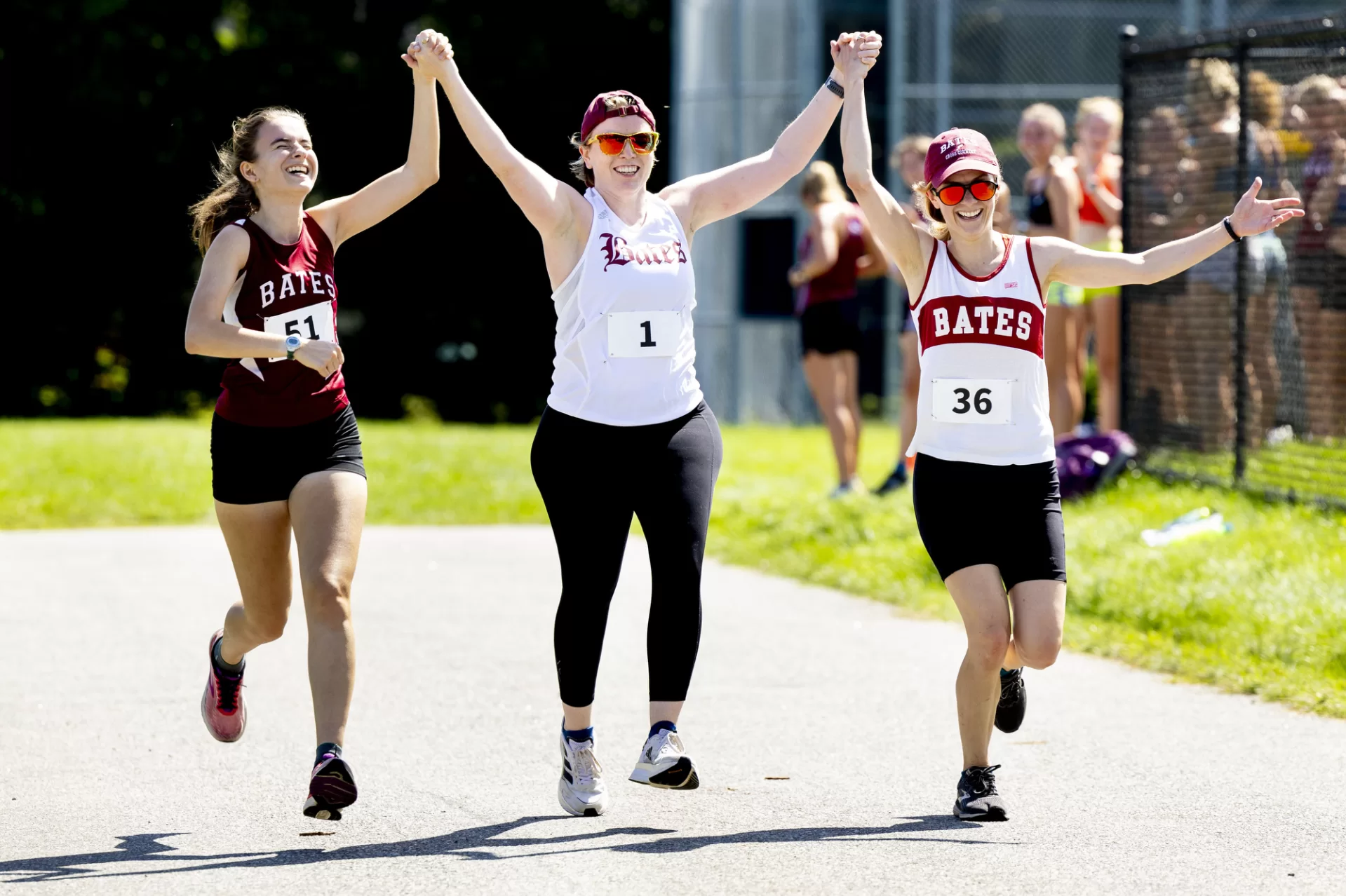 A remarkable seven decades worth of Bobcat harriers descended upon the Bates College campus Saturday (some for the first time in years) as the institution's storied cross-country program came together to celebrate the 50th annual Alumni Meet.
Before the meet began, head women's and men's track and field coach Curtis Johnson spoke to the attendees.

"I want to thank you all for joining us for the 50th annual running of the Alumni race," Johnson said. "Bates is making a lot of upgrades that we're proud about. The biggest thing I can say is that a lot of this is because of all of you. So, I want to thank you all for helping to celebrate this moment. This is a true testament of the Bates community. How we always give back, we support, we show up consistently. And, regardless of when you graduated, you get a chance to show that you are a Bobcat forever."

Nearly 100 alumni donned the garnet and white and toed the starting line for this historic event, a group speckled with participants from the very first outing way back in 1973.