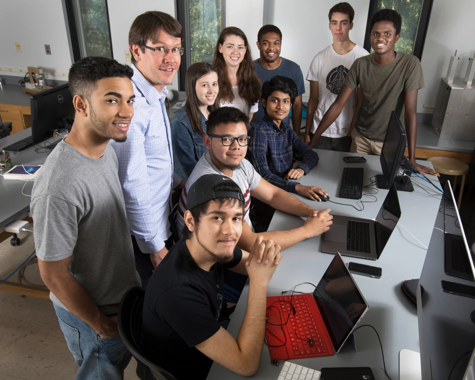 Assistant Professor of Physics Aleksandr Diamond-Stanic has nine student researchers working for him this summer. A variety of grants funds their research.

Identified according to shirts:

Black shirt, baseball hat: Chris Bradna '20 of Guatemala City, Guatemala
Grey and maroon shirt: Jose Ruiz '18 of Lawrence, Mass.
Plaid shirt: Fahim Khan '20 of Dhaka, Bangladesh

Gray shirt: King Valdez '19 of North Andover, Mass.
Dark blue shirt: Kwamae Delva '18 of Conley, Ga.
Denim jacket: Eve Cinquino

White t-shirt: Sophia Gottlieb '17
White t-shirt: Charlie Lipscomb '18 of Bow, N.H.
Green t-shirt: Sanyo Ohene '20 of Accra, Ghana