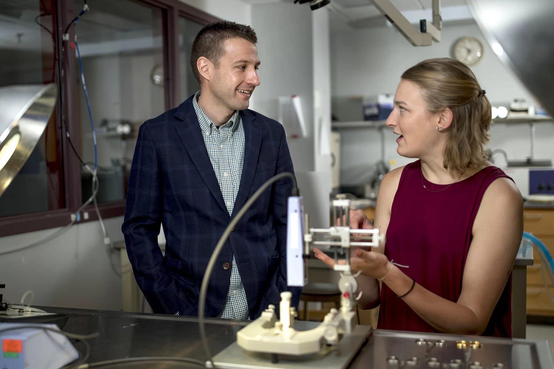 Assistant Professor of Chemistry and Biochemistry Andrew Kennedy poses in Carnegie Science Room 147, aka "the operating room," where Smith has been doing summer research with Kennedy, who says:

"Hannah has been working in the lab for over a year, including last summer. She studies the genetics of learning and memory, and as such uses genetically modified mice and tests their ability to remember where they left objects and how they solve mazes."

Her research is supported by grant from the Sherman Fairchild Foundation (SFF).