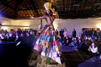 The Trashion Show, including Harvest Meal desserts served by Bates College Dining in Commons on Nov. 16, 2022, was held in the Christian Daggett Gray Athletic Building.Contestants:First Place: Miguel Pacheco '24, wearing stilts and a dress made of recycled book covers, created by Sloan Phillips '25.Second Place: Bora Lugunda '25, wearing a Marie Antionette-inspired gown made from trash bags and plastic sheeting, and a hat made from cardboard and brown packing paper, created by Grace Acton '24Third place: Claire Barlass '25, wearing a self-designed "milk dress" made from discarded milk cartons from Commons, an outfit that was also her Halloween costume this year.Quinn Macauley '24, wearing a "mermaid-inspired" outfit made from trash/discarded swim gear from Tarbell Pool, created by Talia Skaistis '25 and Lianna Rosman '26, all three students are on the Bates Swimming and Diving TeamLily Ritch '25, wearing a "puffy jacket-inspired" outfit made from discarded bubble wrap, chip bags, coupons, mesh orange bag, and straws, created by Emma Righter '23, and accessories by Ella Lungstrum '23 .Leen Dockery '26, wearing a self-created cowgirl-inspired outfit made from discarded cardboard from the Parker 4th floor recycling bin. (I didn't recognize her in the outfit! I remember her from the Visio Divina photos) (edited) 3:39Let me know if you want the self-written descriptions for their outfits. I have the script Theo shared, and I can pick them out (there were a lot of withdrawals, I guess! There are like 13 names on the script)Plus one more male contestant:7. As Abraham Lincoln once said: there is nothing like a sour patch kid to brighten your day! In this issue of munchies, Henry Welch, Ben Huston, and Jonah Yaffee design a chic, yet delicious outfit of sour patches, chips, goldfish bags, and other assorted snacks to express the intrinsic human primal desire for food, and boy does it look good.