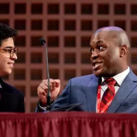 Is it OK to target iconic works of art in the name of social justice? That’s what students from Bates and @morehouse1867 debated at the annual Rev. Dr. Benjamin Elijah Mays, Class of 1920, Debate as part of the college’s Martin Luther King Jr. Day programming. Seen above, Chijindum Dike (left) shares a post-debate celebration with John Curry. Both are students from Morehouse College, and traveled to Bates for the debate. The Bates community and friends crowded into the Olin Arts Center for a much-anticipated part of Bates’ Martin Luther King Jr. Day programming: the debate between four students; two from Morehouse, and two from Bates. The tradition honors Mays, who served as the president of Morehouse College for 27 years. King, then a student at Morehouse, referred to Mays as his “spiritual mentor.” Throughout the debate, the students responded to this year’s motion, “This house believes that the targeting of iconic works of art to advance social justice is justified,” and responded to each other and opinions from the audience. Manuel Machorro ’25 of Mexico City, a politics and philosophy double major, opened the debate on the government side with a quote from Martin Luther King Jr. “Dr. King said ‘if you can’t fly, then run, if you can’t run, then walk, if you can’t walk, then crawl, but by all means, keep moving.’ The claim that we’re gonna make from the government, is that when you’re not listened [to] by anyone, and when the government monopolizes power to destroy you, any way that you see fit is to some capacity justified in pursuing social justice.” Machorro was joined by Dike, a sophomore and double major in psychology and Chinese. The opposition was presented by Curry, a senior and triple major in philosophy, religion, and Chinese, and Andrew Montieth ’24 of Monroe, Wash., a philosophy major. The debaters referenced recent demonstrations, arguing that social justice is furthered by reclaiming spaces and public attention, and the opposition argued that some social activist action diverts attention away from the problem, and onto the targeted object.