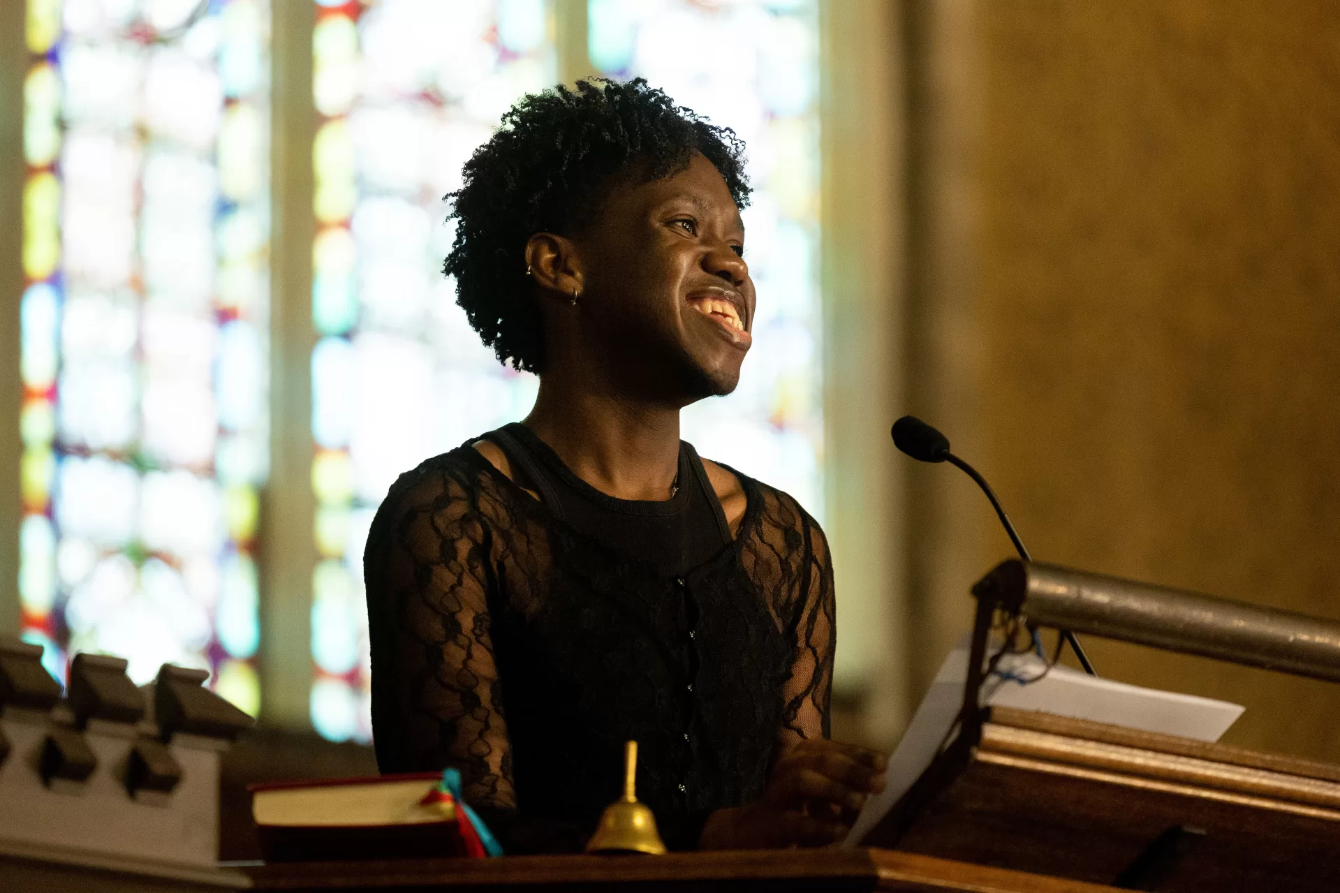 Sam Jean-Francois ’23, an Africana major from Medford, Mass., offers the student welcome during the college's Martin Luther King Jr. Day observance in the Peter J. Gomes Chapel on Jan. 16. 2023. (Phyllis Graber Jensen/Bates College)