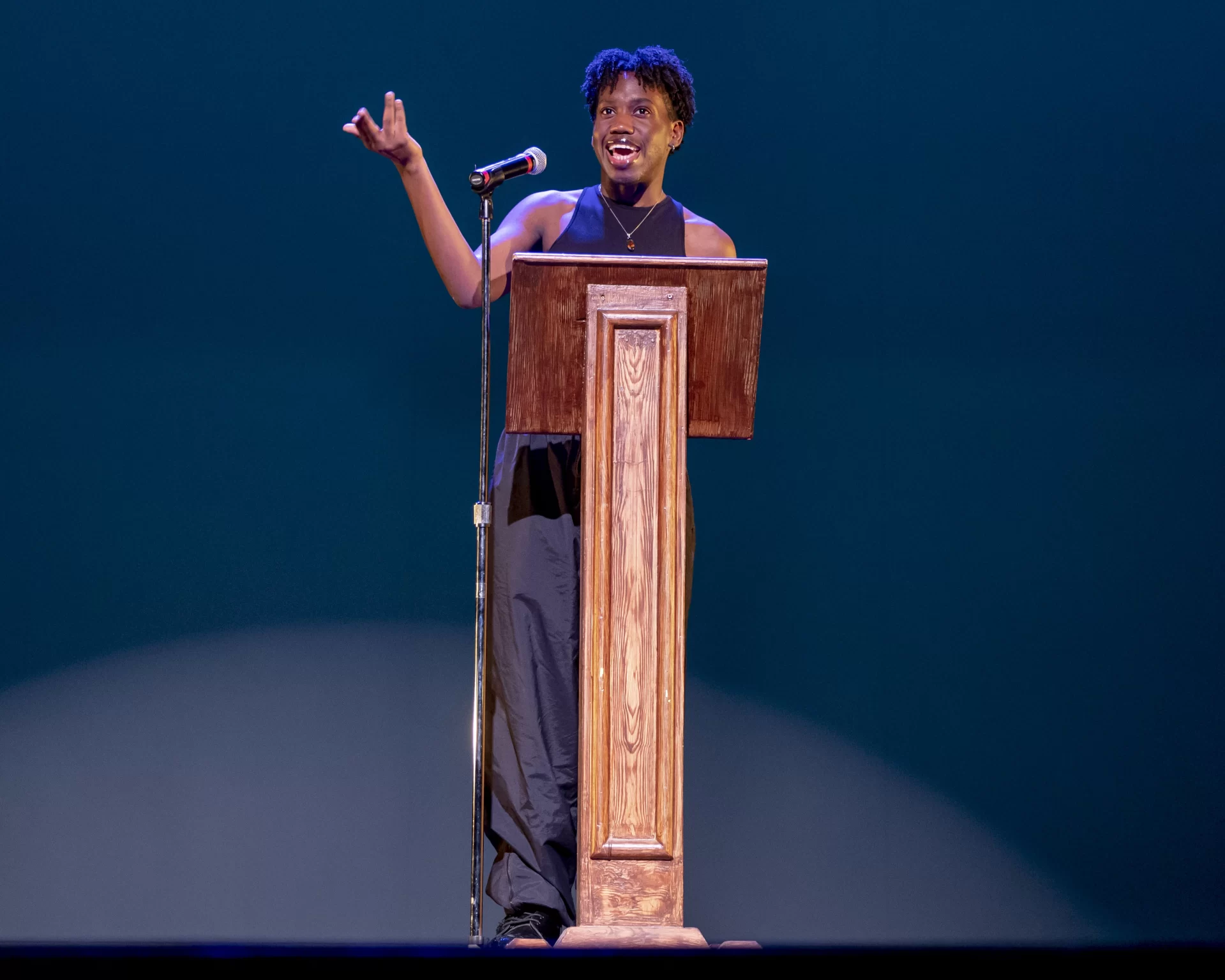 Every seat in Schaeffer Theatre was taken and the audience was buzzing with excitement as they waited for the curtains to rise on the final program of the day: Sankofa, a showcase of culture put on by the Bates’ Black Student Union, features a wide variety of performances by students.

Lauren Reed ’23 of Baton Rouge, La., leaps through the air during a solo dance she performed as part of Sankofa, the final event of Bates’ 2023 Martin Luther King Jr. Day programming.

Sam Jean-Francois ’23 of Medford, Mass., delivered a few opening remarks, followed by a performance of “Lift Every Voice and Sing,” a hymn known as the Black national anthem, sung by Bates’ oldest all-gender Acapella group, the Crosstones, who invited the audience to rise and sing along.

Sankofa, from the Ghanian Akan word for “return,” is a decade-long tradition at Bates, and represents remembrance, memory, and community. In response to the theme of this year’s Martin Luther King Jr. Day programming, “Art and Activism,” this year’s Sankofa aimed to reflect Black grief, Black resistance, and Black joy through poems, dances, speeches, songs, and skits.