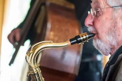 Lou Scolnik '45 is still blowing his horn, joined by Physics professor John Smedley on guitar and area bassist Tim Clough on bass. Surviving members of the Bates V12 Naval program have their annual meeting on Friday October 2 2015 in the Benjamin Mays Center.