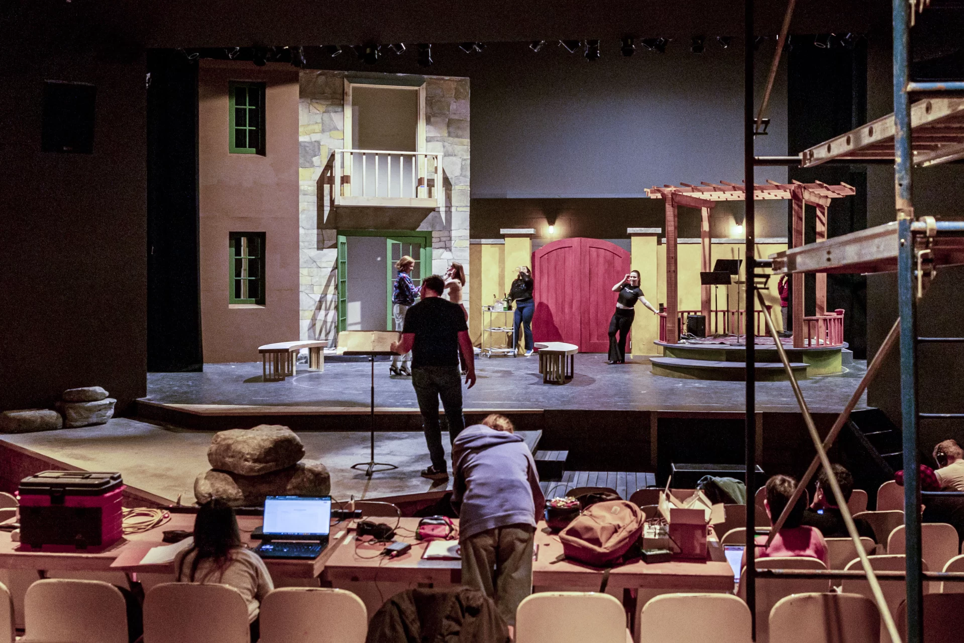 The set for “Much Ado About Nothing” looms above the actors during a rehearsal with director Tim Dugan, assistant director of theater, on the Schaeffer Theatre on Feb. 27, 2023.