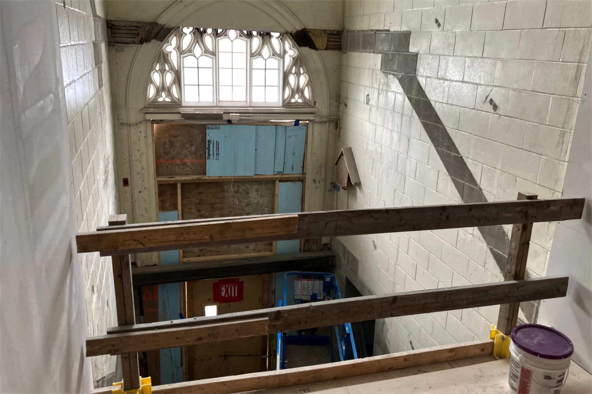 This view of the Chase Hall entrance to Campus Avenue near Kenison Gate was taken from a new section of floor extending into the former stairwell. A glass wall will be placed where the railing is now. (Doug Hubley/Bates College)