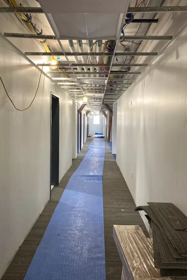 New wall paint, new carpet, and a few new ceiling tiles in Chase Hall’s second floor. (Doug Hubley/Bates College)