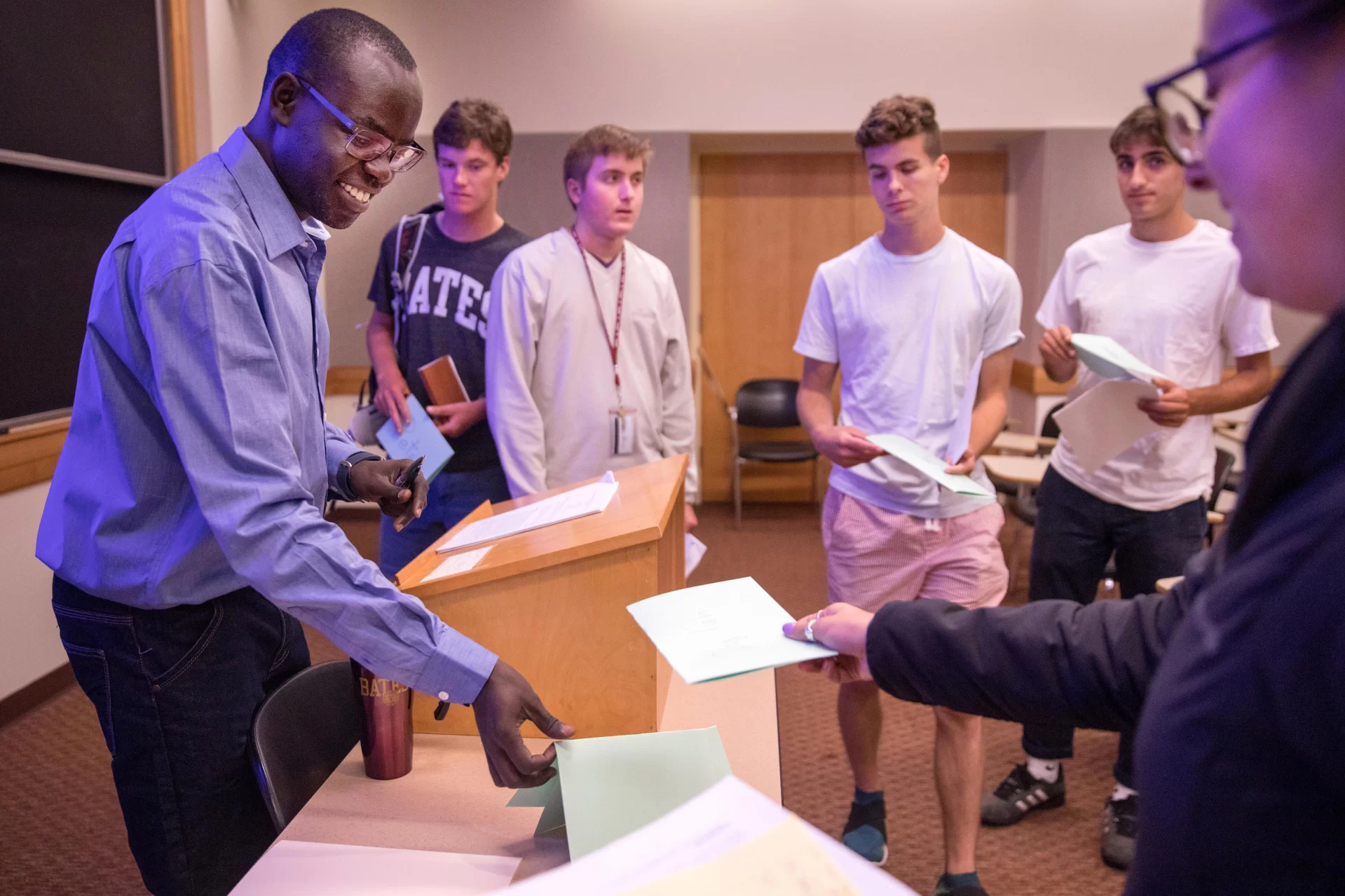 Students in First-Year Seminar FYS 468 - "Beyond Nelson Mandela: Themes and Personalities in South African History"taught by Patrick Otim who told the students: I know you are making the transition from high school to college. The most important thing is to believe in yourself."

Four first-year male students conferring at the end of class, from left to right: Peter Galloway of Hope, Maine, Caleb Giess of Wellesley, Mass., Eli Eshaghpour of New York City, and David Campbell of Marblehead, Mass.


Nelson Mandela became South Africa's first black president in 1994 after more than three centuries of white dominance. Today, he is considered the greatest African leader of the twentieth century. This popular perception, born of Mandela's charisma after walking out of jail and becoming president, cut out many actors and events in the history of South Africa. This course introduces students to these obscured actors and events. It begins by exploring the encounter between Europeans and Africans. It then examines the institutionalization of the apartheid state, and concludes by studing the reactions to, and defeat of, the apartheid state. 
The class, along with all other first-year seminars, met for the first time this morning as an opportunity for students to meet their First-Year Seminar classmates and connect with their instructor, who will also serve as their first-year adviser.
.