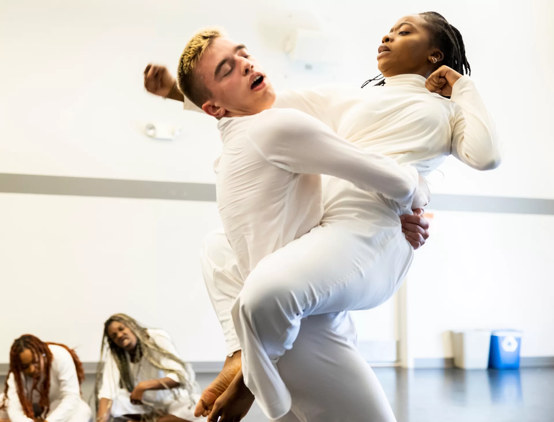 Dance for Peace dress rehearsal in the Marcy Plavin Dance Studio, Meriill Gymnasium on March 12, 2023 before the cast heads to Boston for its Sunday afternoon performance. Under the direction of Russian Peredelskyi ’25. With support from Assistant Professor of Dance Brian Evans.

Ruslan is from Ukraine, mother and grandmother are refugees from Ukraine that have been  resettled under Uniting For Ukraine by Temple Beth Elohim of Wellesley, Mass. 

Majoring in politics, dance, and interdisciplinary
He is performing the full dance on Sunday, March 12, 3:30 p.m.–5:30 at Temple Beth Elohim, Wellesley, Mass., available via livestream, with support from Brian Evans: “I ”will take down a 12-passenger van of Bates students and support the project as an advisor, stage manager, chauffeur, and performer (per Ruslan’s request).”
In 2022, Ruslan received the Harward Center’s Award for Outstanding Community Engagement by a First Year Student (“Rookie of the Year” Award). 
Ruslan is a peer health educator. 
Ruslan has volunteered locally with AK Health and Social Services (AKHSS), which is designed to help disadvantaged immigrant students. 
Ruslan graduated from the prestigious Kyiv State Ballet College
Ruslan will spend the 2023-34 academic year studying politics at Oxford University.

Students in the rehearsal: Verina Chatata ’26 with red braids;
Mariana Kaluba ’26,  with short brown braids;
Olivia Krug ’26, tall dancer with braids;
Abbey Ende ’23 in brown shirt;
Marin Ackerman ’26 with makeup at the mirror; 
Sarah Senator ’25 with mascara who read the first poem;
Francisca Rocha ’24, in brown turtleneck and pants in manicure and masks piece;
Adya Agarwal ’24, manicure;
Nina Gonzalez ’23, hair in bum with brown dress pants and beige shirt;
Jane Durmm ’25 sitting on the side with a pony tail;