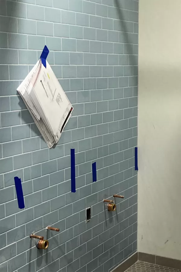 Cool blue tiles in a new Chase Hall restroom near the Overnook. (Doug Hubley/Bates College)