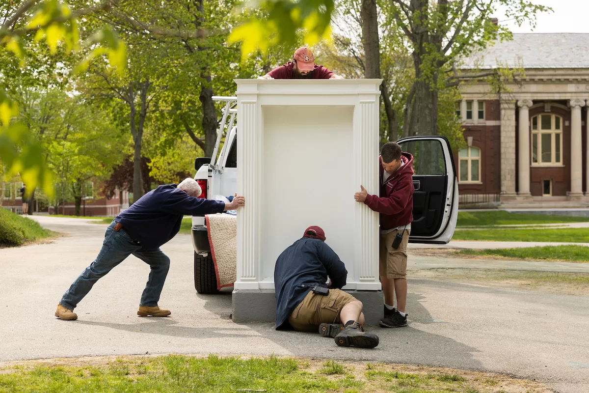 The updated Mouth Piece on the Historic Quad, with glass doors and posters in place on May 15, 2023.

Jason Therrien blue shirt hat, carpenter
Thomas Winslow blue sweatshirt, lead carpenter
Matthew Capone, garnet bates hat, carpenter
Dave Weiss red zippered sweatshirt, locksmith
Yamil Peralta Burgos, tan golf shirt, lead electrician