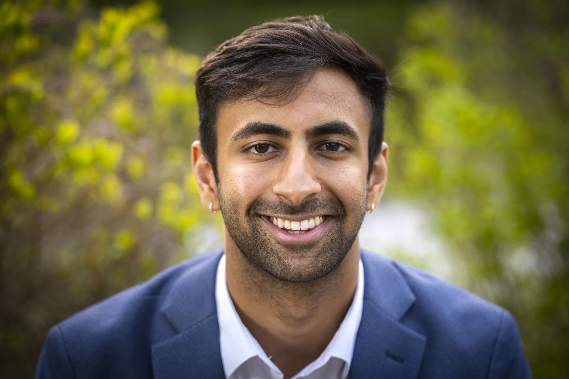 Rishi Madnani ’23 of Langhorne, Pa., senior commencement speaker for the Class of 2023, poses for a portrait in the Keigwin Amphitheater overlooking Lake Andrews,