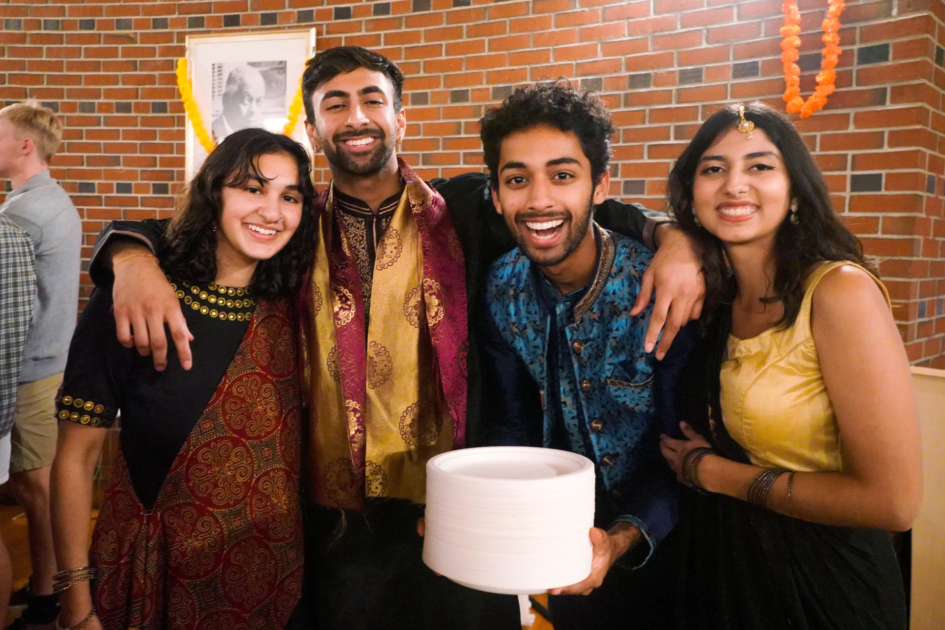 November 5th, 2022 - On Saturday evening students gathered in the Benjamin Mays Center to celebrate Diwali, the Festival of Lights, with Indian food, music, and dance. This event was organized by the South Asian Student Association(SASA) at Bates and was one of the several events put on throughout the weekend. 

Zahra Freedman'23, Krishna Kakani'25, Rishi Mandani '23, and Amisha Kalra'23 get excited to eat some delicious food and celebrate Diwali.