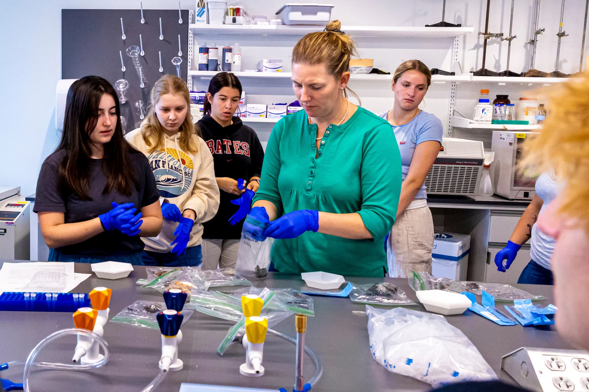 Associate Professor of Biology Larissa Williams teaches students in Bio s39f a lesson on “uses of Genetic analysis to understand the population of dynamics of crabs in Maine.” They met in Bonney 370 laboratory and received instruction on how to use a pipette, including closing their eyes in preparing to click the instrument.

The course’s instructor is Jesse Minor ’00, a lecturer in biology.