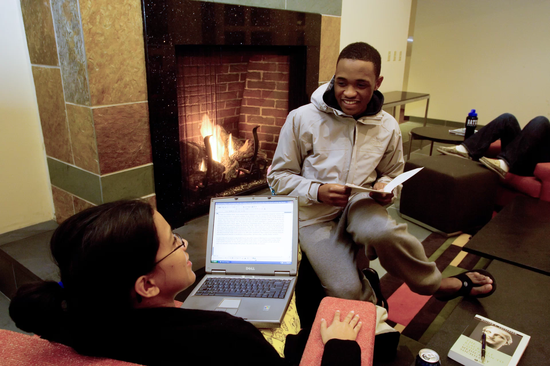 Donna Rampersad ’08 of Chaguanas, Trinidad and Tobago, speaks with Kimal McCarthy ’09 of Nantucket, Mass., in Frank’s Lounge at the new student housing (Phyllis Graber Jensen/Bates College)