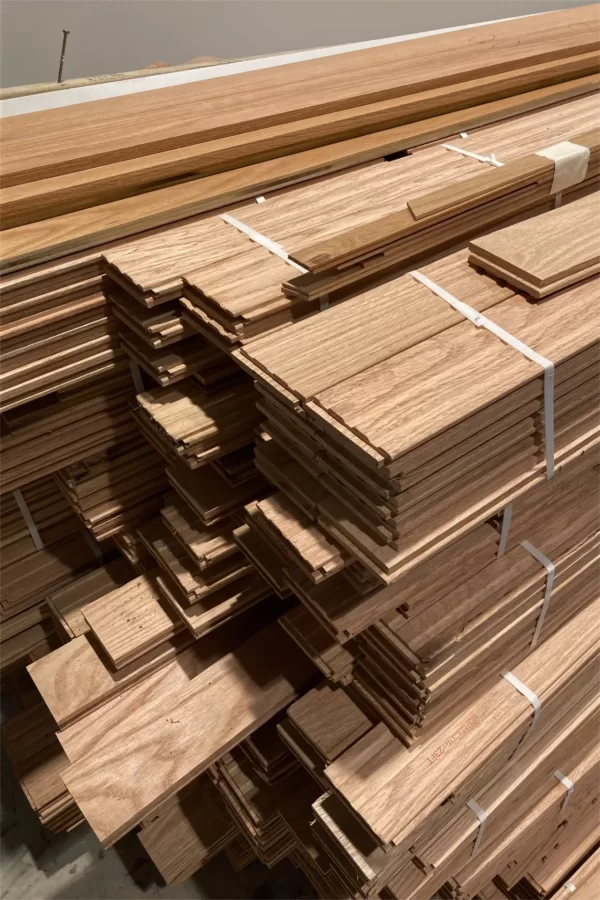 This hardwood flooring will be installed in Chase Hall Lounge toward the end of the Chase renovation. Shown on June 27, it was stored in the Chase Hall lobby to acclimate. (Doug Hubley/Bates College)